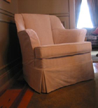 chair with pink slipcover by Take Cover